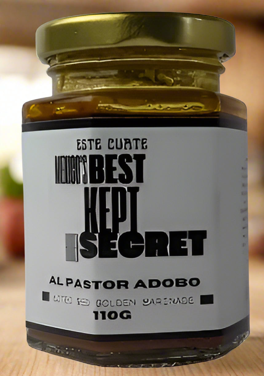 Jar of al pastor adobo with a gold lid and white label.
